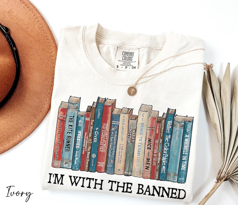 a hat and a t - shirt with books on it