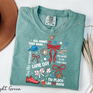 a t - shirt with a picture of a game day on it