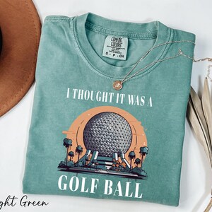 a t - shirt that says i thought it was a golf ball