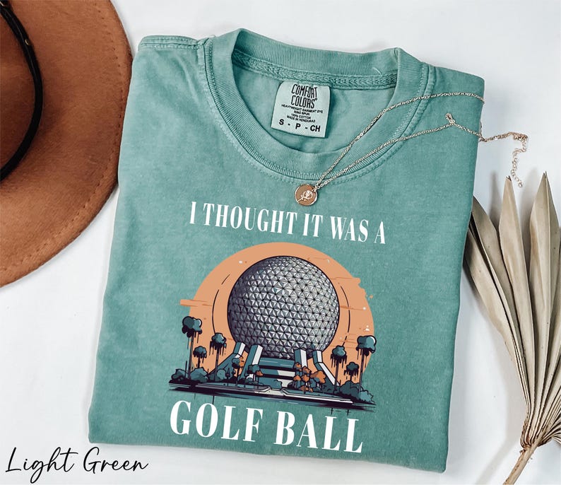 a t - shirt that says i thought it was a golf ball
