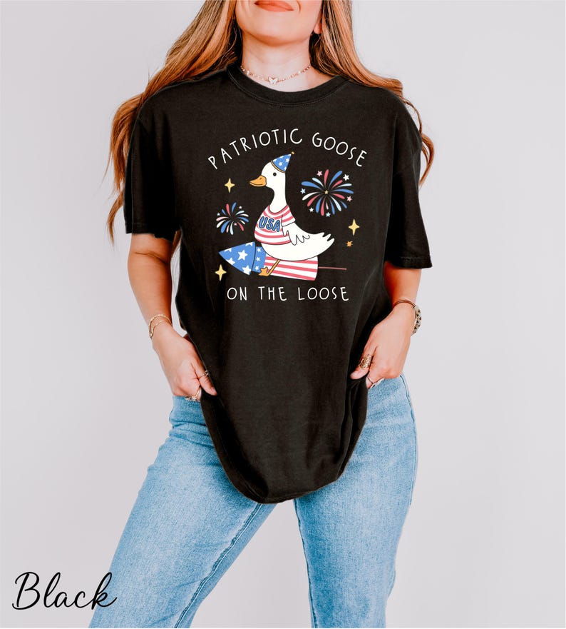 a woman wearing a patriotic goose on the loose shirt