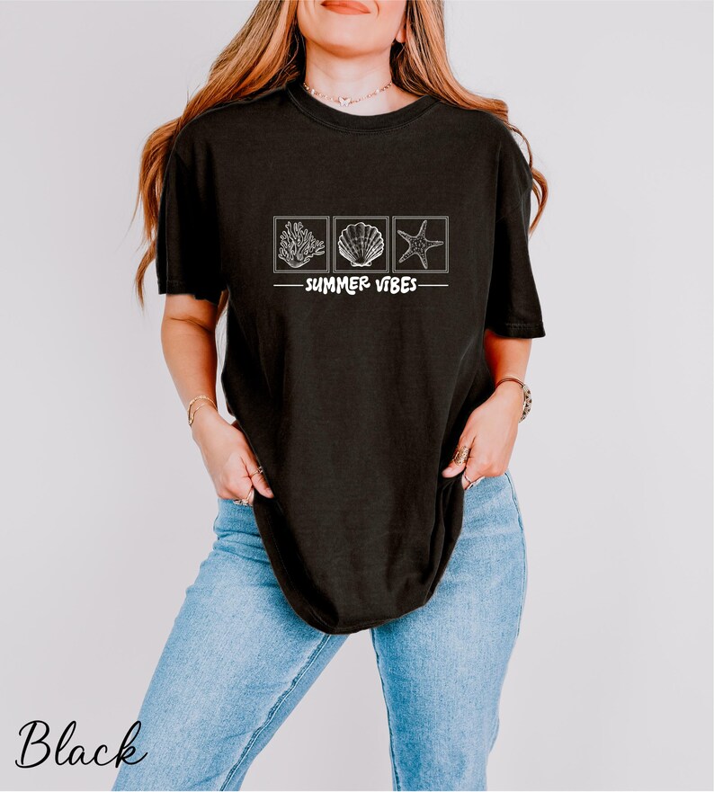 a woman wearing a black shirt that says summer vibe