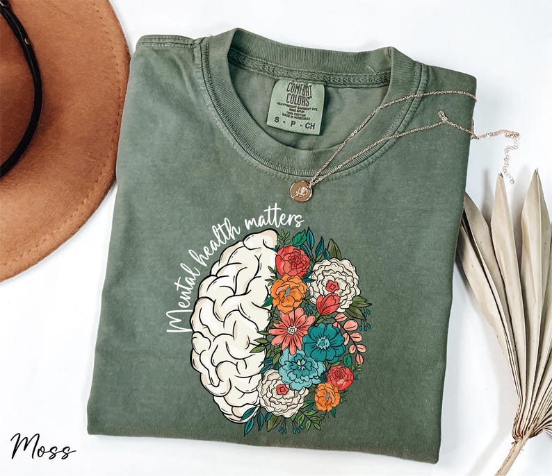 a t - shirt with a brain and flowers on it