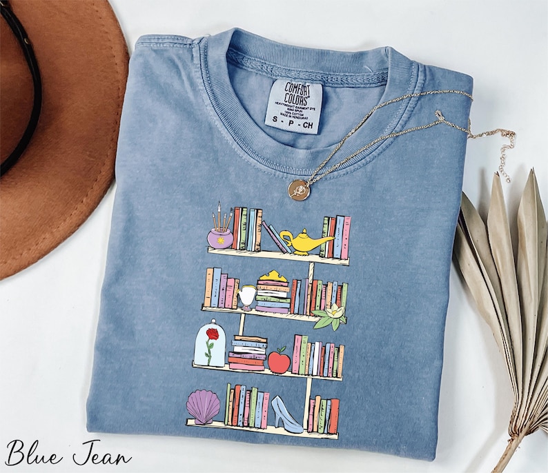 a t - shirt with a picture of a book shelf on it