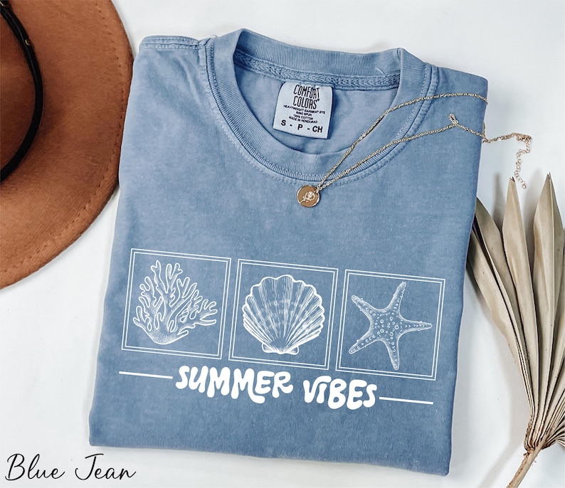 a t - shirt that says summer vibes on it