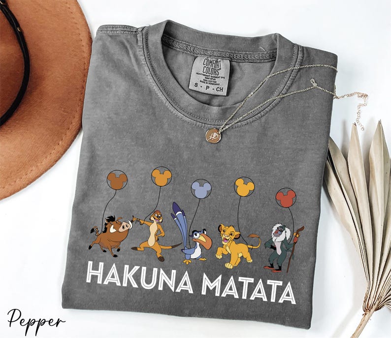 a gray tshirt with a picture of hakuna matata on it