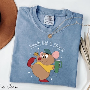 a blue shirt with a cartoon character on it