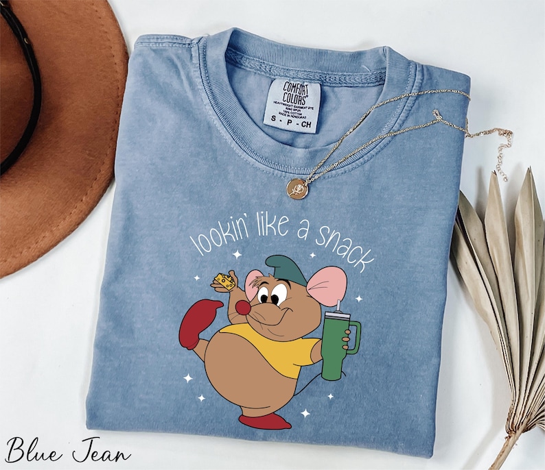 a blue shirt with a cartoon character on it