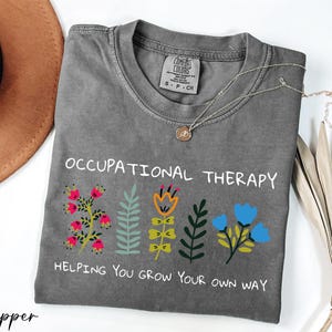 a t - shirt that says,'occupational therapy helping you