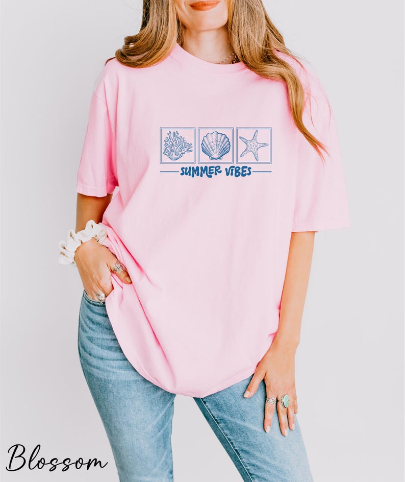 a woman wearing a pink shirt and jeans