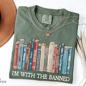 a t - shirt with a bunch of books on it