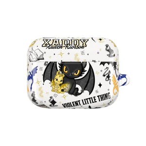May include: White AirPod case featuring a black dragon with yellow eyes and a smaller yellow dragon. The case has a repeating pattern of stars, dragons, and the text "XADDY" and "VIOLENT LITTLE THING".