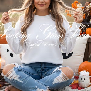 May include: A white long-sleeve sweatshirt and distressed blue jeans. The image includes pumpkins, autumn leaves, and decorative pillows. The text "Looking Glass Views Digital Downloads" is displayed across the top of the image.