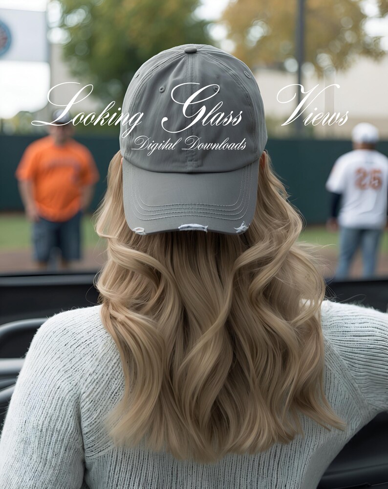 May include: A gray baseball cap with a distressed look and the text "Looking Glass Views Digital Downloads" on the front.