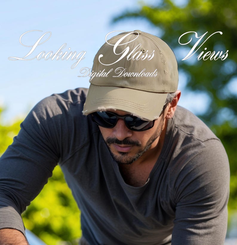 May include: A man wearing a khaki baseball cap with the text "Glass Views Digital Downloads" on the front. He is wearing sunglasses and a gray t-shirt.