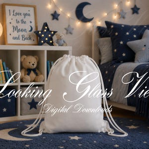 May include: A white drawstring bag sits on a blue rug with a crescent moon design. The background features a child's bedroom with a bookshelf, teddy bear, and a bed with star-shaped pillows and a framed print that reads "I Love you to the Moon and Back."