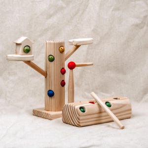 Montessori wooden worm catcher toy set with tree stand, log block, magnetic stick, and colorful worms