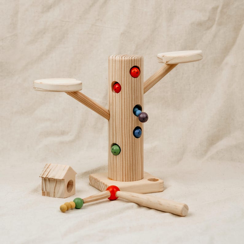 Wooden tree-style magnetic worm catching game with colorful worms and magnetic fishing stick