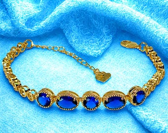 Pulsera de cristal azul en tono dorado: joyería elegante para mujer