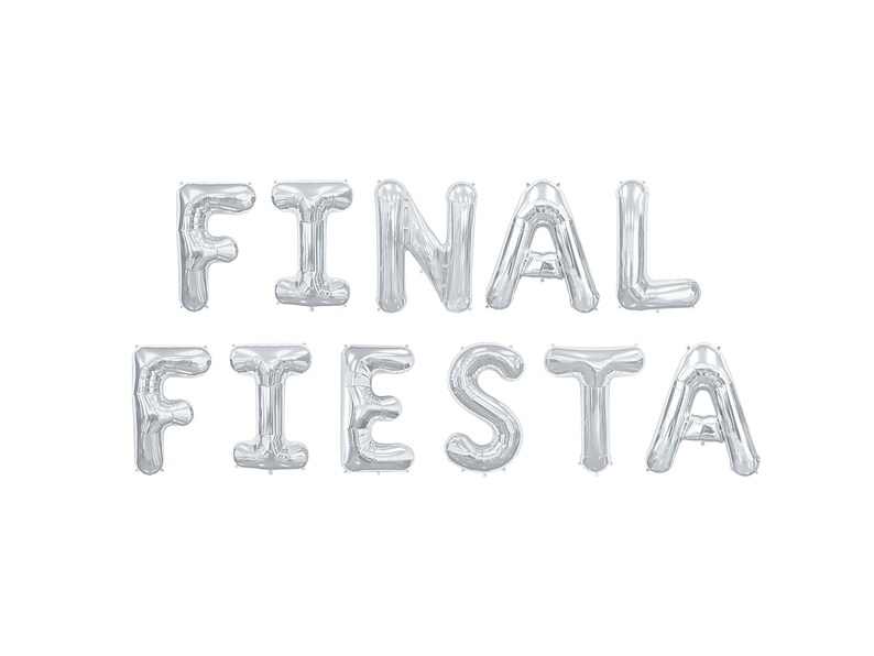 May include: Silver foil balloons spelling out "FINAL FIESTA" against a white background. The balloons are inflated and arranged in two rows, with "FINAL" on top and "FIESTA" below. Ideal for a party or celebration.