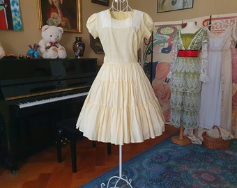 Vintage cocktail dress in size. S/Meter from the 1950s in yellow and cream