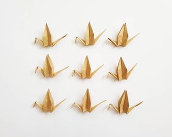 Origami Kraniche in Gold