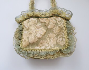 Bolso de mano brocado vintage de estilo barroco.