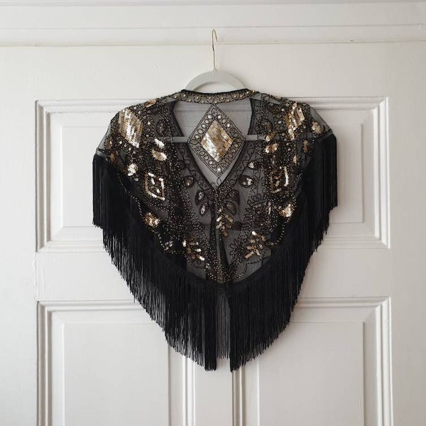 20s style dream cape "Flapper Girl" in black and gold with sequins and fringes in size. 32-40