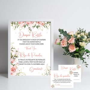 Puede incluir: Un cartel con un diseño floral rosa y verde con el texto "Diaper Raffle" e instrucciones para una rifa de pañales. El cartel también incluye el texto "Rifa de Pañales" e instrucciones en español.