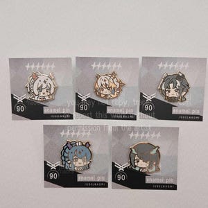 May include: Five enamel pins featuring anime-style character designs. Each pin is on a card with the number 90 and the text "enamel pin" and "JUBELNAOMI". The pins have different color schemes and character designs.