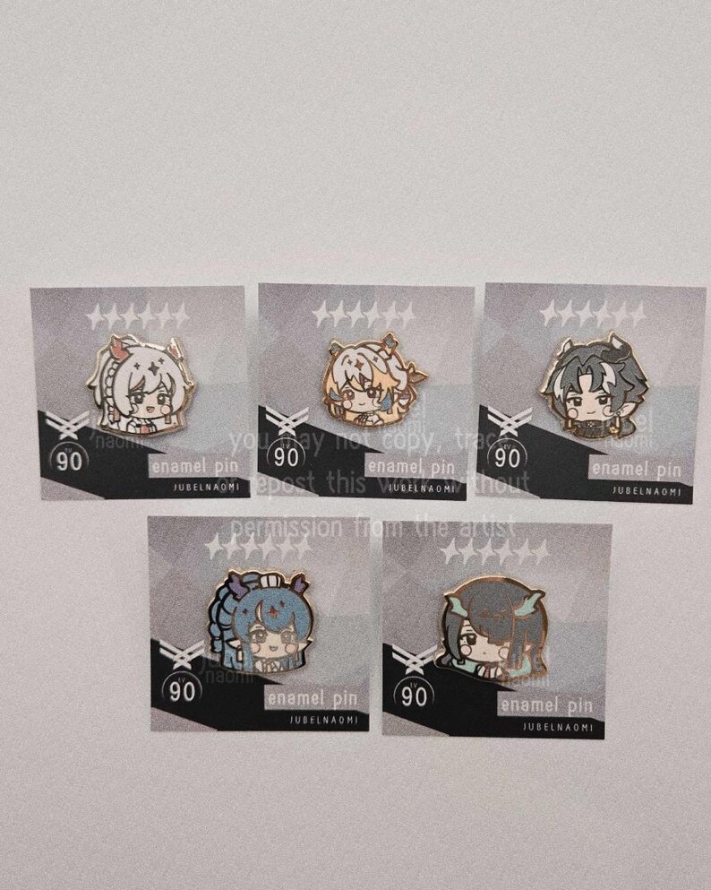 May include: Five enamel pins featuring anime-style character designs. Each pin is on a card with the number 90 and the text "enamel pin" and "JUBELNAOMI". The pins have different color schemes and character designs.