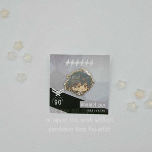 May include: A silver enamel pin featuring a cartoon character with blue hair and a small figure. The pin is on a gray card with text that reads "enamel pin" and "you may not copy or repost this work without permission from the artist."