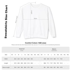 May include: A white crewneck sweatshirt size chart for Comfort Colors 1466. The graphic displays a white sweatshirt with lines indicating length, width, and sleeve length. A table provides measurements in inches for sizes S through 3XL.