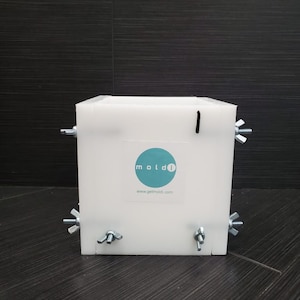 May include: White plastic square mold with four silver wing nuts and a blue circle logo that says "moldi" and "www.getmoldi.com".