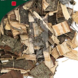 May include: A close-up of a pile of dried, light brown and dark brown bark pieces. The bark is broken into irregular shapes and sizes. The bark is a natural product and is used in traditional Chinese medicine.