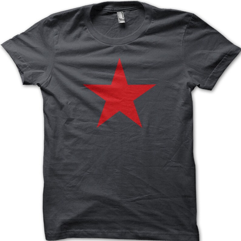May include: A dark gray t-shirt with a large red five-pointed star in the center.
