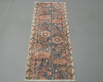 May include: A vintage runner rug with a floral pattern in shades of pink, blue, and white. The rug has a fringed edge and a traditional design.