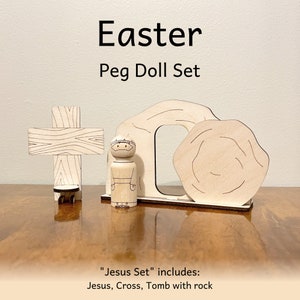Easter peg doll set that includes Jesus, a cross on which the Jesus peg doll can stand, and a Tomb with rock.