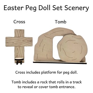 Easter peg doll set scenery includes a cross with a platform for a peg doll and a tomb that includes a rock that rolls in a track to reveal or cover the tomb entrance.