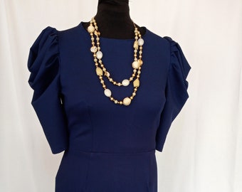 Navy blue round neck dress with short leg of mutton sleeves