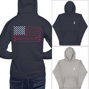 May include: A navy blue hoodie with a white golf club design on the front and a golf ball and club American flag design on the back.