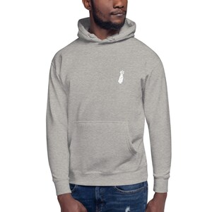 May include: A heather gray hooded sweatshirt with a white graphic of a hand with a flower growing from it.