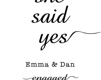 May include: A white background with black text that reads "she said yes" in a cursive font. Below, it says "Emma & Dan engaged" and the date "17/08/23". The overall theme is engagement.
