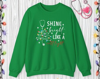 Suéter navideño / Divertido regalo navideño para enfermeras / Diseño festivo de estetoscopio para profesionales de la salud Sudadera con capucha brillante como una llamada
