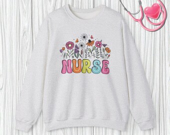 Sudadera de enfermera con flores: un regalo colorido para profesionales de la salud. Prenda de agradecimiento para enfermeras y héroes médicos.