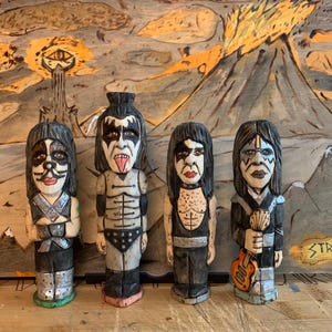 Hand-carved Kiss Band impersonators. Carved by knife on 1-inch-square blocks of Basswood