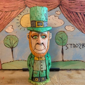 Hand carved  folk art wood Leprechaun figurine.