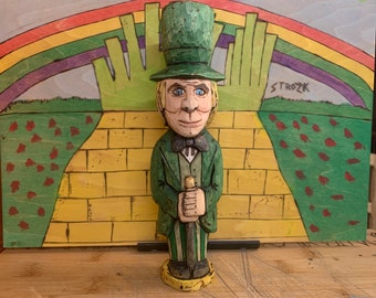 A hand-carved Folk Art style Man behind the curtain, The Wizard of Oz from the 1939 film, "The Wizard of Oz"