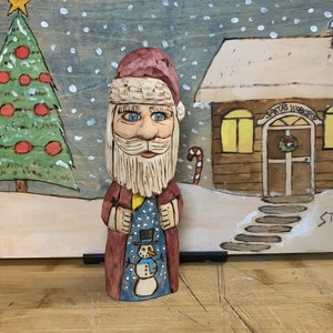 Hand-carved Folk Art Santa Claus Figurine with Snowman.