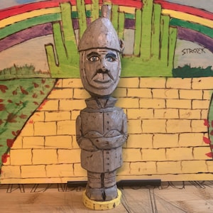 A Hand carved Folk Art style Tinman from the 1939 film, &quot;The Wizard of Oz&quot;.